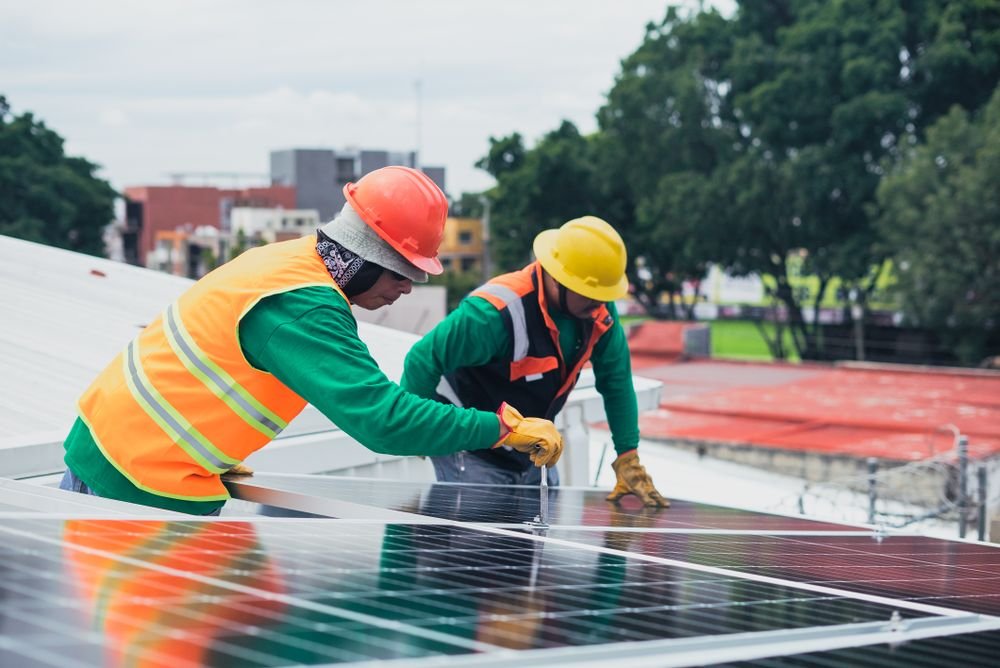 RAKAR Energy technicians installing rooftop solar panels